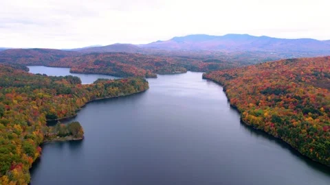 Aerial Drone Fly Over New England Lake in Autumn Fly In Stock Footage 256048547