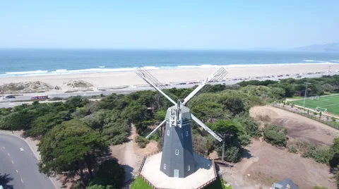 Aerial Drone Fly Over Windmill to ocean beach Stock-Footage 67337070