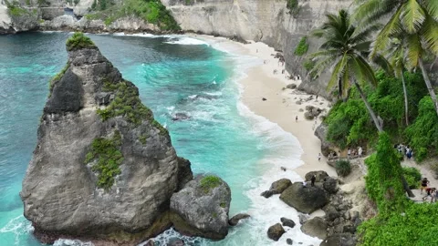 Aerial Drone Fly Through Rock Formation Over Diamond Beach, Nusa Penida Bali Stock-Footage 330540524