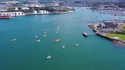 Aerial Drone Flyback Over Harbour with Moored Boats and Incoming Ferry 4k Stock Footage 320946477