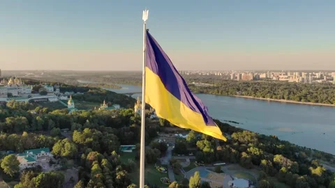 Aerial Drone Flyby Shot in Kyiv - Biggest National flag of Ukraine. Aerial view Stock Footage