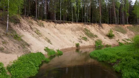 Aerial drone flying around a u-turn of a wild river with sandy banks Stock Footage 169929031