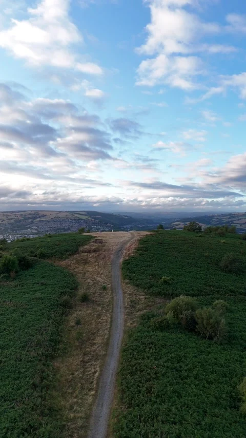 Aerial Drone Flying Backwards Over Caerphilly Mountain, Wales Stock Footage 343577738