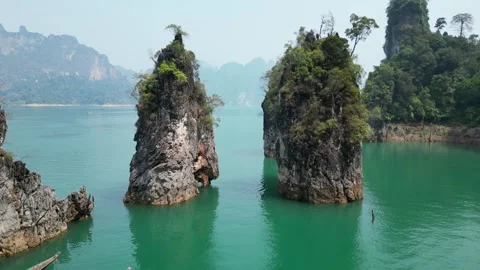 Aerial Drone Flying Between Limestone Cliffs in Khao Sok, Thailand Stock Footage 335580698