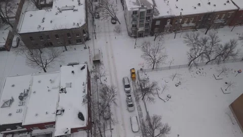 Aerial Drone Flying Close Behind Snow Removal Truck In Montreal Winter 4K 動画素材 272681360