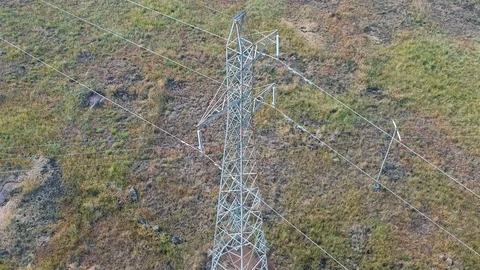 Aerial drone flying down over rural electricity pylon tower Video stock 90150932