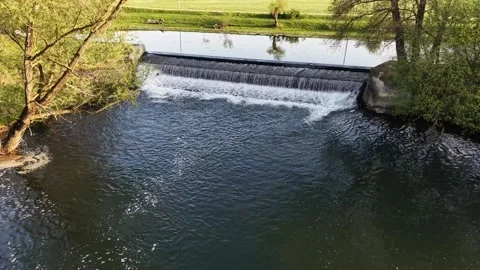 Aerial Drone Flying Forward and Rising Above River Dam Waterfall Video stock 332991865