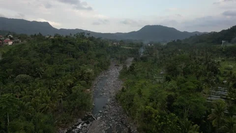 Aerial Drone Flying Forward Over Resort Area Over River and Green Field in Bali Vídeo Stock 327255977