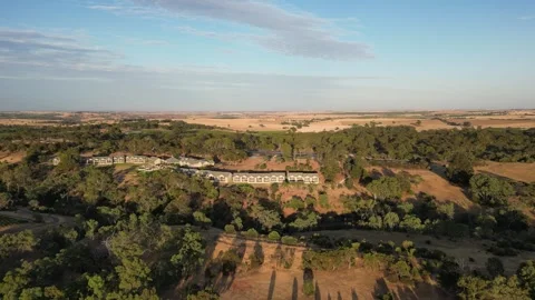 Aerial Drone Flying Forward Over Small Villa in a Dry Drought Yellow Farmland Vídeo Stock 328143238