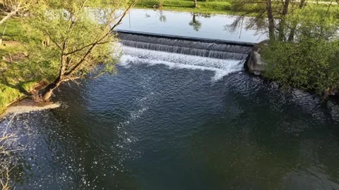 Aerial Drone Flying Forward Over River and Small Dam Waterfall Video stock 332993588
