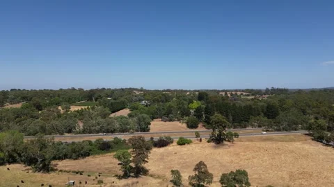 Aerial Drone Flying Forward Over Dry Drought Yellow Farmland in Rural Area Stock Footage 333364739