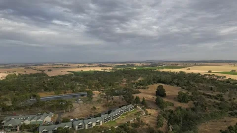 Aerial Drone Flying Forward Over Dry Drought Yellow Farmland in Rural Area Stock Footage 333370966
