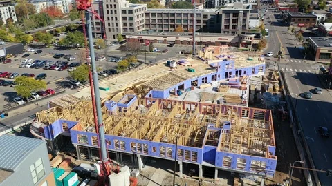 Aerial Drone Flying next to an on-going construction site 4K with cranes 스톡 동영상 118279853