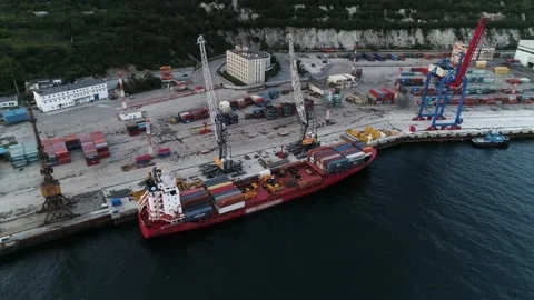 Aerial. Drone flying over a container ship and ship's automatic loaders Video stock 140032387