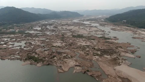 AERIAL DRONE FLYING OVER DRY MEKONG RIVER DROUGHT DAM IMPACTS FLOW Stock Footage 119992706