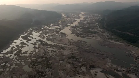 AERIAL DRONE FLYING OVER DRY MEKONG RIVER DROUGHT DAM IMPACTS FLOW Stock Footage 119995673