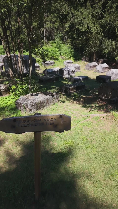 Aerial Drone Flying Over Educational Trail Wooden Sign Towards Ancient Stecak  Stock-Footage 343151670