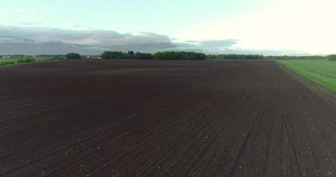 Aerial drone flying over empty agriculture field and meadow in Slovenia Stock Footage 144188589