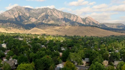 Aerial drone flying over flat irons mountains from a distance at chautauqua park Stock-Footage 102684756