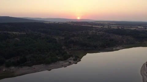 Aerial drone flying over La Cuerda del Pozo Reservoir in Soria at sunset Видео 342606629