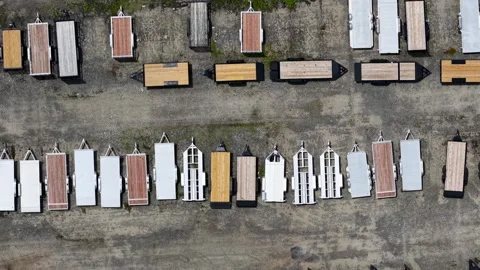 Aerial drone flying over a large parking lot full of trailers Stock Footage 340952044