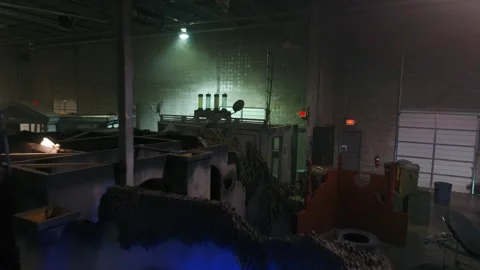 Aerial: Drone Flying Over Props And Objects Amidst Cottages At Illuminated Film Video stock 249334359