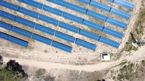 Aerial drone flying over solar panel farm power plant Stock Footage 338196972