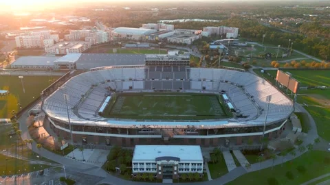 Aerial drone flying over UCF FBC Mortgage Stadium at sunrise Stock Footage 340486378