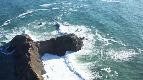 Aerial Of Drone Flying over waves crashing on Point Bonita Lighthouse, Marin Stock Footage 125765734