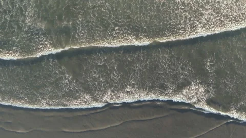 Aerial drone flying over waves washing on an empty beach Stock-Footage 153202976