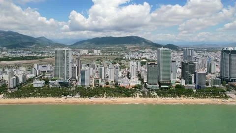 Aerial drone flying parallel to the white sand beach coastline full of Stock-Footage 196041759