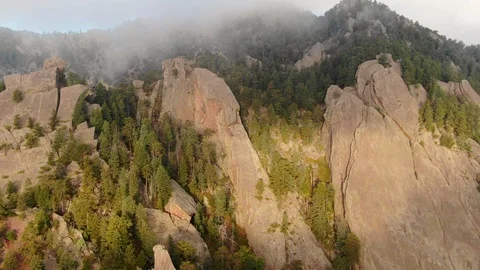Aerial drone flying in sunlight flat irons mountains at chautauqua park in Bould Stock Footage 102682986