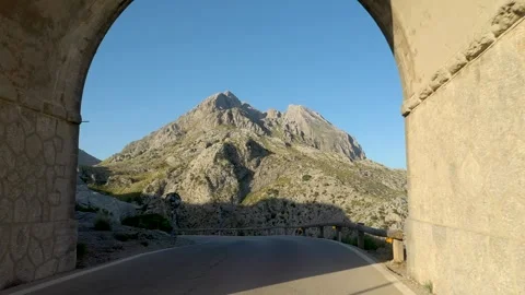 Aerial drone flying through an arch and revealing breathtaking nature landscape Stock-Footage 254536353