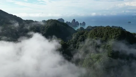 Aerial Drone Flying Through Clouds Revealing Tropical Islands in Ao Nang, Krabi, Stock Footage 334723286