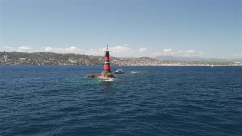 Aerial drone flying toward Fourmigue rock near Antibes France.horizontal Stock Footage 344757315