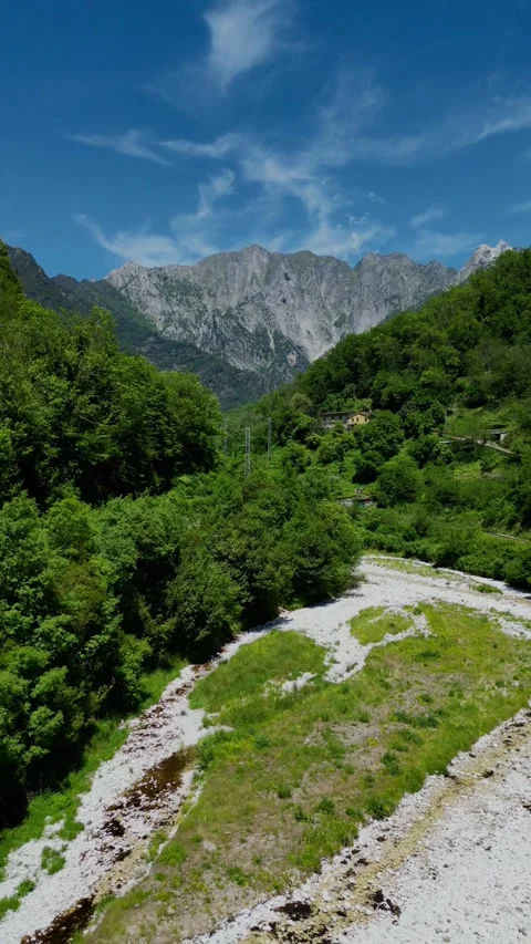 Aerial Drone Flying Toward Mountain Valley and River in Tuscany Italy Summer  Stock Footage 329054402