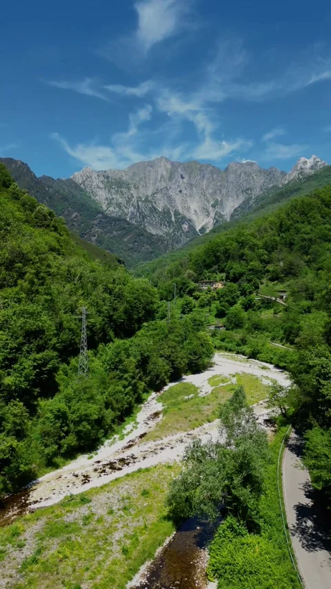 Aerial Drone Flying Towards Mountain Valley and River in Malbacco Tuscany I.. Stock Footage 329054409