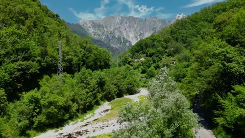 Aerial Drone Flying Towards Mountain Valley and River in Malbacco Tuscany I.. Stock Footage 329054417