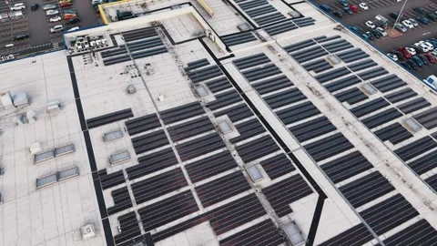 Aerial Drone Flyover Warehouse Rooftop Solar Panels UK — Green Energy and Stock Footage 334125242