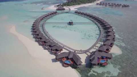 Aerial Drone Focused on Oval Shaped Jacuzzi Water Villas Stock-Footage 80951820