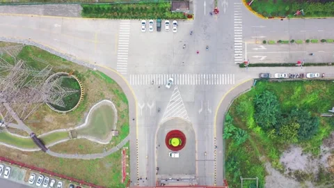 Aerial drone footage of busy intersection with traffic and pedestrians. Stock Footage 336317834