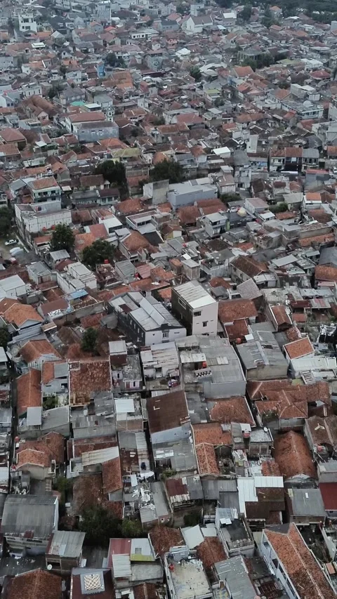 Aerial drone footage capturing dense residential housing in the heart of Bandung Video stock 329402772