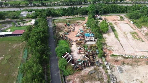 Aerial drone footage capturing an expansive industrial equipment salvage Video stock 320107344