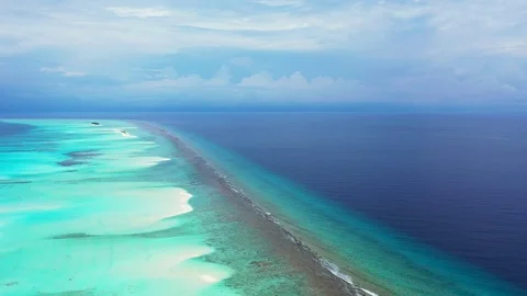 Aerial drone footage of clear tropical water with coral reef in Maui, Stock Footage 111008786