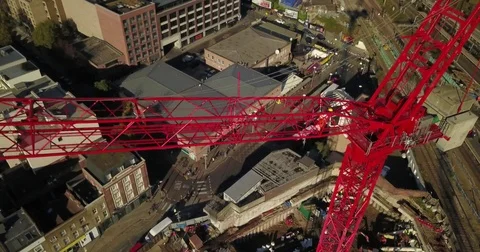 Aerial drone footage of construction workers on a tower crane. 스톡 동영상 82324391