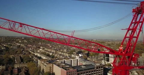 Aerial drone footage of construction workers on a tower crane. Vídeos de archivo 82325982