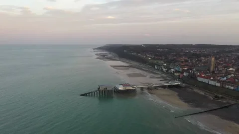 Aerial Drone Footage of Cromer pier in Norfolk at sunset Stock Footage