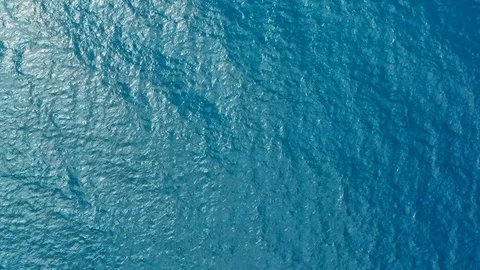 Aerial drone footage of the deep blue clear sea ocean water with small waves Stock Footage