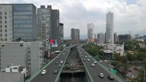 Aerial drone footage of an elevated highway and urban traffic. Stock Footage 336211537