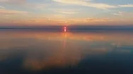 Aerial Drone Footage. Fly Over Calm Water To Sunset Stock Footage